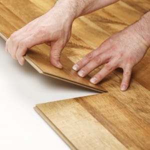 Person fitting laminate flooring